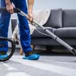 person cleaning carpet with vacuum cleaner picture id1191080465