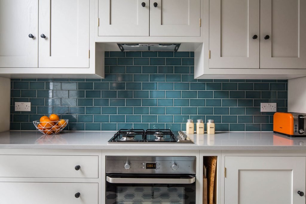 Quirky retro Shaker kitchen with quartz worktop and Fired Earth Retro green Metro tiles 1024x683 1
