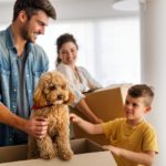 husband wife their son pet moving new home husband wife their son dog moving new home family 214706791