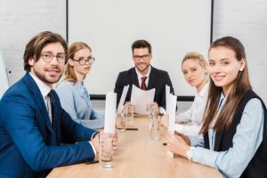 stock photo team smiling business people sitting