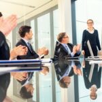 businessmen applauding a young businesswoman s presentation 492986610 57714b3a3df78cb62c6c8374
