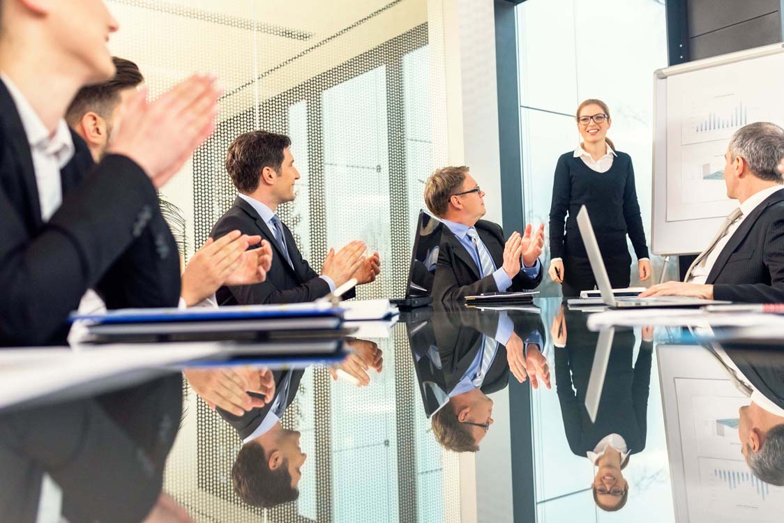 businessmen applauding a young businesswoman s presentation 492986610 57714b3a3df78cb62c6c8374